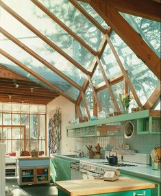 a kitchen with green cabinets and an open roof