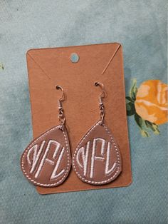 "These earrings are embroidered on faux leather, with your choice of thread color . Very comfortable and light weight ! Perfect mother's day gift 😍 1.5 \" and the ear wire is sterling silver ." Monogram Earrings, Embroidered Monogram, Custom Earrings, Etsy Earrings Dangle, Ear Wire, Mother's Day Gift, Jewelry Earrings Dangle, Mother's Day Gifts, Mother's Day