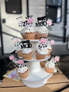 there are cupcakes that have been decorated to look like farm animals on them