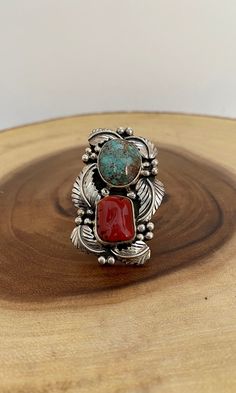 "DOUBLE UP * amazing craftsmanship * stacked red coral shell and green turquoise stone * beautiful feather and pearl drop frame * split double band HALLMARK: AT, Sterling DIMENSIONS: face: 2\" x 1 1/4\" ring size: 9 WEIGHT: 20g MATERIALS: sterling silver, turquoise, and red coral COLOR: silver, green, and red CONDITION: excellent!" Southwestern Red Gemstone Jewelry, Southwestern Style Red Gemstone Jewelry, Bohemian Red Multi-stone Jewelry, Unique Red Multi-stone Turquoise Ring, Southwestern Style Red Ring Jewelry, Red Bohemian Multi-stone Rings, Bohemian Red Multi-stone Ring, Red Bohemian Jewelry For Collectors, Red Natural Stones Nature-inspired Jewelry