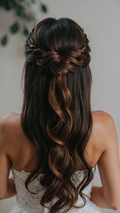 a woman with long hair wearing a wedding dress