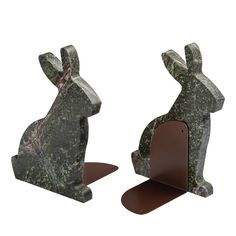 two green marble rabbit bookends sitting next to each other