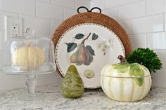 plates and fruit are sitting on the kitchen counter