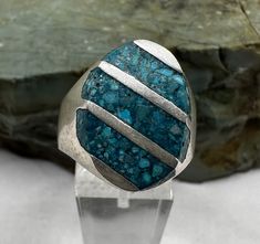 This bold ring features three turquoise chip stripes inlaid in sterling silver. Size 10.75 and in very good condition. The markings on the inner band are not clear. Condition is good, light tarnish, scuffs and scratches.  Thank you for looking! Prices on shop items are fair and reasonable, so all prices are firm.  No reserves all items sold as-is. Please review photos and description carefully before purchasing.  Please let me know if you have any questions or special shipping requests such as p Bold Rings, California State, Rings Statement, Gold And Silver, Vintage Sterling Silver, Statement Rings, Insurance, Jewelry Rings, Let Me