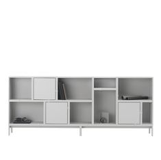 a white bookcase with many compartments on it