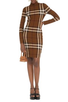 This dress is like the perfect cup of tea—warm, cozy, and just the right amount of stylish flair. It's designed for those days when you want to feel effortlessly chic without compromising comfort. Honestly, who can resist a classic, checked pattern with a modern twist? Season: FW22 Color: brown Made in: ITALY Composition: 95% Viscose, 5% Elastane Department: WOMEN | Burberry Women's Checked Jersey Mini Dress in Brown | Size UK 4 | 8057106135776 Color B2486 Burberry Dress, Checker Design, Dress Tight, Checkered Design, Turtleneck Dress, Turtle Neck Dress, Burberry Women, Dress Pant, Emilio Pucci