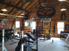 the inside of a gym with various equipment and signs on the walls that read victory