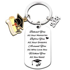 a keychain with an image of a graduation cap and diploma on the front