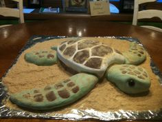 a cake shaped like a turtle sitting on top of a table