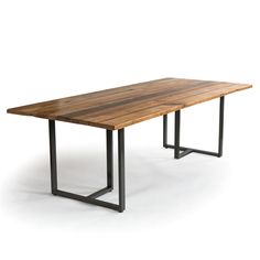 a wooden table with metal legs on a white background