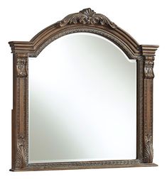 a large mirror with ornate carvings on the frame and an intricate border around the edge