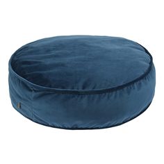 a blue round dog bed on a white background