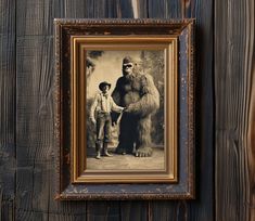 an old photo of a man standing next to a bigfoot in front of a wooden wall