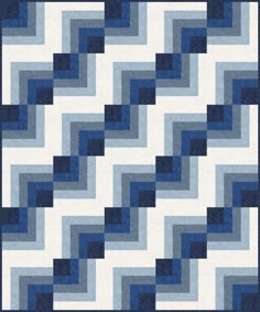 a blue and white quilt with wavy shapes