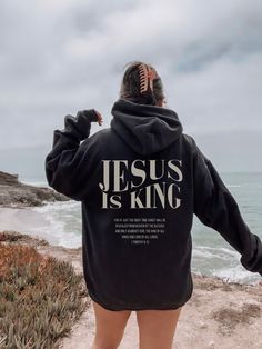 Jesus is king sweatshirt, Jesus is king hoodie, Jesus hoodie, Christian hoodie, Christian merch, Christian clothes, Christian streetwear, Gospel shirt, Jesus clothes Purchases above $35 are eligible for free shipping. 🐣 NOTE: Our female model wears a 2XL size sweatshirt. Our sweatshirts are unisex and true to size. For an oversized look, you need to order 1-2 sizes bigger than your normal size. We house several industrial printing technologies that allow us to apply ink directly into a textile, so there is no fading, peeling, or cracking. ⇒ How Do I Order ❶ Please review all the information provided before placing your order ❷ Select the item type and size using the drop-down menu ❸ Select the color of the shirt/hoodie using the following drop-down menu. Don't ignore checking all color op Christian Sweatshirts Storage, Jesus Aesthetic, Make Heaven Crowded, Christian Clothes, Christian Streetwear