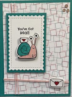 a close up of a card with a snail on it