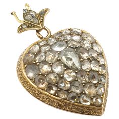 Antique rose cut diamond heart pendant with an estimate diamond weight of 3.5 carats back foiled technique centered with a pear shape rose cut diamond decorted with a lotus flower on top pendant messurments 3.5cm length in 10k gold finest dates back to the ottoman era 1850/1880.c Luxury Heart-shaped Rose Cut Diamond Jewelry, Luxury Heart-shaped Jewelry With Rose Cut Diamonds, Antique Teardrop Rose Cut Diamond Jewelry, Heart-shaped Rose Cut Diamond Jewelry For Formal Events, Heart-shaped Rose Cut Diamond Jewelry For Formal Occasions, Formal Heart-shaped Rose Cut Diamond Jewelry, Formal Heart-shaped Jewelry With Rose Cut Diamonds, Victorian Pear-shaped Diamond Jewelry, Heart-shaped Rose Cut Diamond Wedding Jewelry