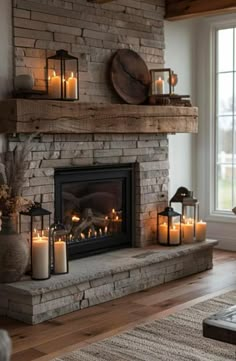 a living room with a fire place filled with candles