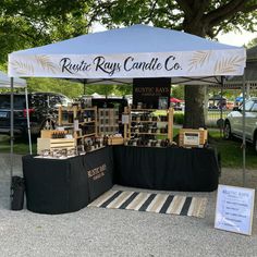 an outdoor market tent set up on the pavement