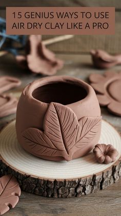 a clay planter sitting on top of a wooden table next to other clay plants