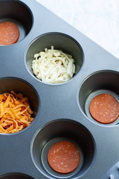 the cupcake tins are filled with different types of food