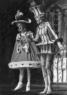 two women dressed as clowns standing next to each other