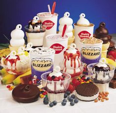 an assortment of ice creams and desserts on a table