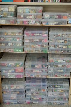 the shelves are filled with many plastic containers