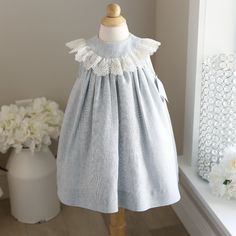 This Little Float Dress By The Bailey Boys Is Adorable!! The Dress Is Done In A Cotton Linen And Is Lined In A Poly Cotton Blend Slip. The Slip Has A Tier Of Tulle For Added Volume. The Top Front Has A Yoke Where The Gathers Of The Skirt Meet. The Round Bib Collar Has A Gorgeous Scalloped Embroidered Lace Trim Done In White. The Back Has A Yoke With A 2 Button Closure. Super Adorable Little Dress! Great For Beach Or Family Portraits, Weddings, Church, Vacation Dinners Or Fancy Lunches. New With Light Blue Sleeveless Dress For Baptism, Blue Lace Trim Dress For Baptism, Blue Cotton Dress For Baptism, Vacation Dinners, Fancy Lunches, Off White Lace Dress, Float Dress, Crochet Lace Collar, Portrait Dress