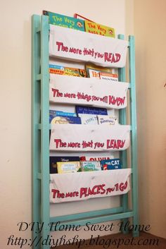 a blue book shelf with several books on it