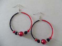 Black and red beaded hoop earrings Black Hoop Earrings With Colorful Beads For Gift, Black Hoop Earrings With Colorful Beads As Gift, Gift Black Hoop Earrings With Colorful Beads, Red Colorful Beads Hoop Earrings, Red Hoop Earrings With Colorful Beads, Red Beaded Round Hoop Earrings, Adjustable Red Beaded Earrings With Black Beads, Red Beaded Earrings With Black Round Beads, Red Hoop Earrings With Colorful Beads For Jewelry Making