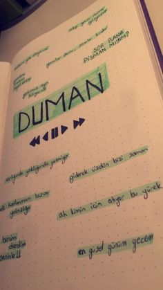 an open notebook with writing on it and the words duman written in cursive