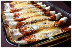 a casserole dish filled with cheese and chicken enchilada bread sticks