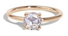 a gold ring with an oval cut diamond