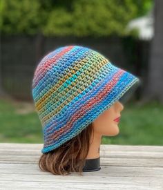 The colors in this bucket hat are so pretty! Wear it with the brim rolled up or down to keep the sun out of your eyes Crocheted using my favorite soft acrylic yarn  Hand wash cold and lay flat to dry Multicolor Winter Cloche Hat With Short Brim, Winter Vacation Bucket Hat, Multicolor Curved Brim Cloche Hat For Winter, Multicolor Winter Cloche Hat With Curved Brim, Bohemian Multicolor Sun Hat For Warm Weather, Lightweight Multicolor Summer Bucket Hat, Multicolor Bucket Hat For Spring Outdoor, Bohemian Lightweight Multicolor Sun Hat, Spring Multicolor Bucket Hat For Outdoor