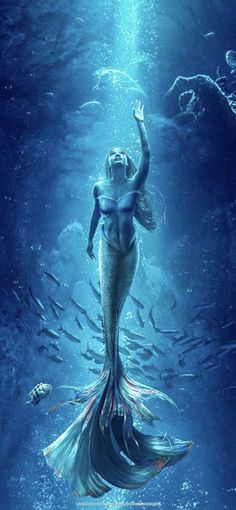 a mermaid is swimming in the water