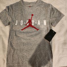 Heather Grey Soft Jordan T Shirt For Kids. New With Tags Nike Sizes Show That A Small Is For Ages 8-10. Jumpman Logo Large On Front And A Small One On The Sleeve. Nike Tshirt Design, Jordan Clothes, Jordan Tshirt, Jordan Rose, Jordan Shirt, Jordan T Shirt, Everyday Fits, Kids Tee Shirts, Jordan Shirts