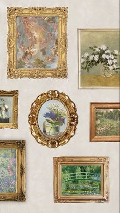 there are many paintings on the wall and one has a gold frame with flowers in it