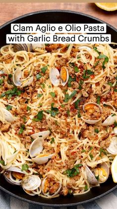 clam aglio e olio pasta with garlic bread crumbs in a skillet