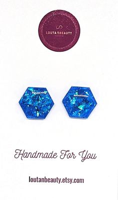 Indulge in the allure of resin with our captivating earrings. Each pair is a burst of color and style, meticulously handcrafted to add a touch of elegance to any outfit.  These beautiful blue stud earrings have blue reflective flake encapsulation, giving them exceptional shine and depth! They measure 1.5cm across. These earrings come with hypoallergenic stainless steel posts for your peace of mind. The posts may be made from gold or rose gold plating based on the photos.  Please note variations Blue Stud Earrings, Phone Screens, Hypoallergenic Jewelry, Star Shape, Bright Blue, Jewelry Earrings Studs, Beautiful Blue, Gold Plating, Earrings Handmade