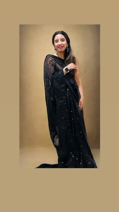 Dazzel like a star in this beautiful party perfect mesmerizing Georgette net saree where elegance meets charm.. Color - A beautiful shade of black Fabric - Magnificent and soft ,elegant net made of Georgette Technique - An interplay of fabric and sequin creating a drape that delicately scintillates and transforms in movement and light. The saree is ready to wear with falls, pico and piping finished in finesse , and unstitched blouse fabric is included. Note: Colors that show up on your screen may vary slightly from the actual product due to variations in settings. Also, the actual product may appear to be different hues depending on the ambience lighting. Since this is a handwoven saree there may be very slight inconsistencies such as in the weave/motifs work, these being characteristics a Festive Black Pre-draped Saree With Self Design, Elegant Black Pre-draped Saree With Zari Work, Elegant Party Pre-draped Saree With Zari Work, Black Sequined Pre-draped Saree, Glamorous Black Pre-draped Saree, Glamorous Floor-length Saree With Zari Work, Elegant Black Pre-draped Saree For Evening, Elegant Evening Saree With Resham Embroidery, Net Lehenga For Evening