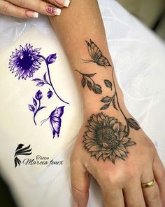 a woman's hand with a tattoo on it and a sunflower in the middle