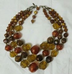 Vintage Gold Tone Three Strand Graduated Bead Necklace | eBay Vintage Beaded Necklaces With Colorful Beads, Vintage Adjustable Faceted Beads, Vintage Amber Jewelry With Large Beads, Adjustable Vintage Beads For Jewelry Making, Vintage Beads For Jewelry Making, Vintage Amber Jewelry With Colorful Beads, Adjustable Brown Vintage Necklace, Retro Brown Beaded Jewelry, Vintage Brown Adjustable Necklace