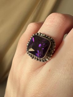 Vintage square cut synthetic amethyst ring made by a New York artisan decades ago. Set in sterling silver, size 6. Weighs 5 grams. Marked 925 on the inside of the band. Important note on refunds and returns: Due to past fraudulent orders, we cannot accept returns in our shop and cannot offer store credit. All sales are final. Thank you so much for understanding and for supporting our small business. Formal Purple Rings With Rectangular Stone, Purple Rectangular Sterling Silver Ring, Rectangular Silver Amethyst Ring In Sterling Silver, Formal Purple Sterling Silver Ring, Vintage Silver Square Cut Ring, Greek Ring, Vintage Clip Earrings, Glass Drop Earrings, Woodland Hills