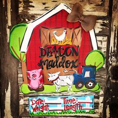 a barn door decorated with farm animals and words