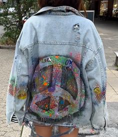 We will make this or a very similar denim jacket for you with a match of up to 85%. 100% copy is impossible when working in abstract/graffiti technique. Stylish oversized denim jacket with custom design. Features a large image of pacific symbol on the back, the design in graffiti on the front, collar and area of elbows and distressed fabric elements. Perfect for those who want to stand out! Our model is 180 sm tall and wears size S-XS Product dimensions: length 71 cm shoulder width 59 cm sleeve Denim Blue Graphic Print Denim Jacket For Fall, Denim Blue Jacket With Graphic Print For Fall, Spring Denim Blue Jacket With Graphic Print, Casual Blue Outerwear With Graffiti Print, Trendy Medium Wash Denim Jacket With Graphic Print, Trendy Oversized Denim Jacket With Graphic Print, Multicolor Denim Outerwear With Graphic Print, Acid Wash Grunge Denim Jacket For Streetwear, Grunge Acid Wash Denim Jacket For Streetwear