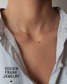 A pretty minimalistic ball necklace made with a simple 14k ball bead and cable chain. Details: Solid 14k Gold dainty cable chain 4mm Ball bead 14k Measures 16 inches #jewelry #simplenecklace #necklace Cheap Minimalist Jewelry With Delicate Chain, Minimalist Necklace Gold Short, Cheap Delicate Chain Necklace For Everyday, Cheap Minimalist Chain Jewelry, Affordable Simple Round Pendant Necklaces, Cheap Minimalist Chain Necklace, Cheap Delicate Classic Chain Necklace, Cheap Everyday Dainty Chain Necklace, Cheap Minimalist Pendant Jewelry