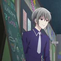 an anime character standing in front of a chalkboard with writing on it and wearing a tie