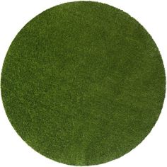 a round area rug made out of green grass