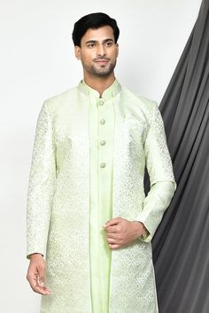 Green full sleeves sherwani with all over persian flora woven detailing. Paired with a sleeveless inner kurta and churidar. - Aza Fashions Long Sleeve Jamawar Nehru Jacket For Wedding, Festive Long Sleeve Jamawar Nehru Jacket, Festive Long Sleeve Nehru Jacket In Jamawar, Formal Pista Green Sherwani With Chikankari Embroidery, Pista Green Sherwani With Chikankari Embroidery For Formal Occasions, Festive Jamawar Long Sleeve Bandhgala, Festive Long Sleeve Jamawar Bandhgala, Festive Jamawar Bandhgala With Long Sleeves, Elegant Pista Green Bandhgala For Eid